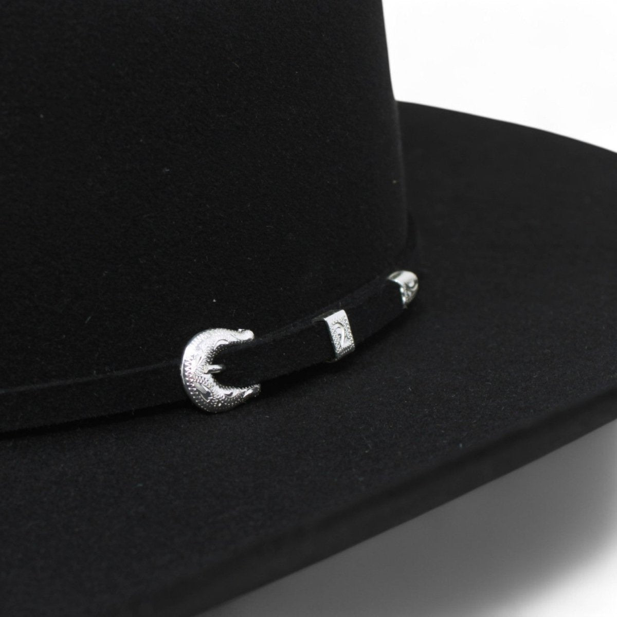 Black Serratelli 100X felt western hat with traditional cattleman crown and premium wool blend - close up