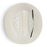 Sombrero vaquero Morcoon 100X color natural con horma Rancher, copa con pequeñas perforaciones decorativas, ala ancha curvada y toquilla de listón negro, fotografiado sobre fondo blanco. Top