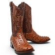 Black Label men's western cowboy boots featuring a cognac ostrich print leather foot, dark brown embroidered leather shaft, square toe, leather sole, and traditional cowboy heel. Handcrafted western boots with exotic-inspired texture and classic ranch styling. pair
